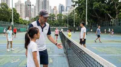 Coach teaching junior footwork at Victoria Park