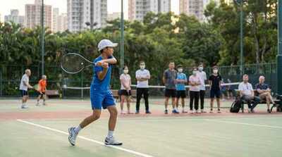 Junior boy hitting backhand at Victoria Park