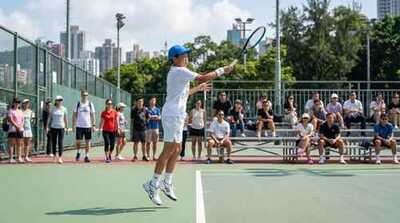 Junior boy hitting volley at Victoria Park