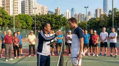 Adult receiving coaching feedback at Victoria Park
