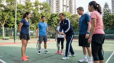 Coach demonstrating proper grip at Victoria Park