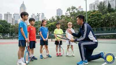 Coach instructing junior group at Victoria Park