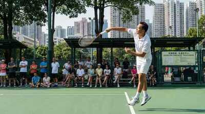 Adult serving during private lesson at Victoria Park