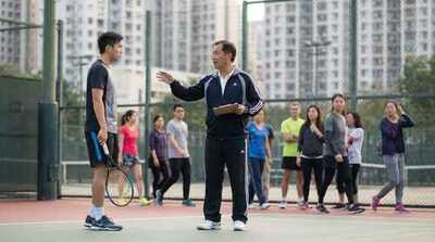Adult male receiving coaching feedback at Victoria Park