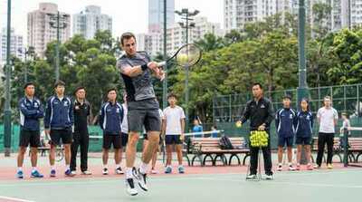 Adult hitting volley during lesson at Victoria Park